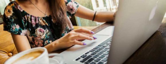 Woman taking BACB recertification on computer