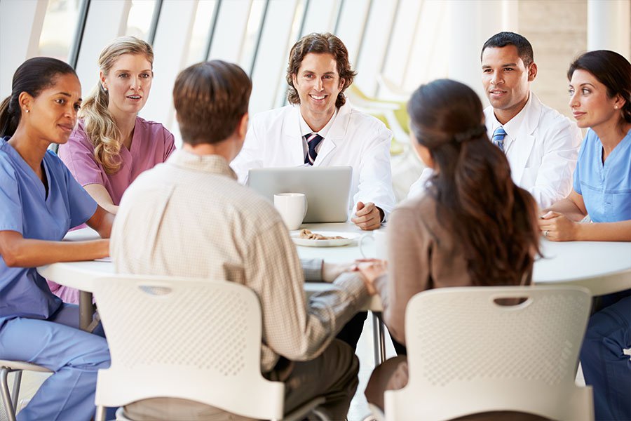 doctors and nurses meeting together