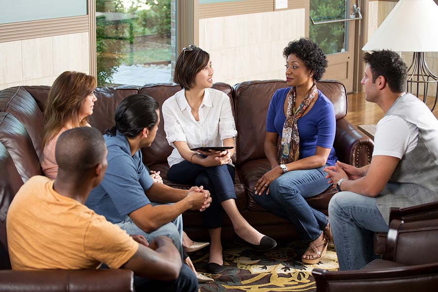 people meeting together on a comfy couch