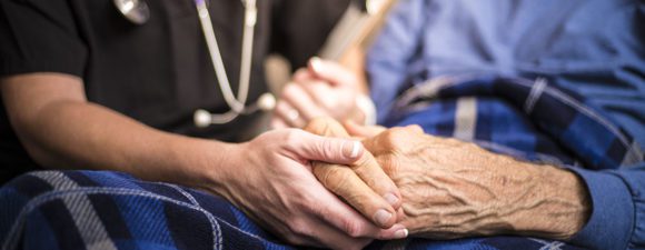 Hospice Nurse visiting an elderly male patient