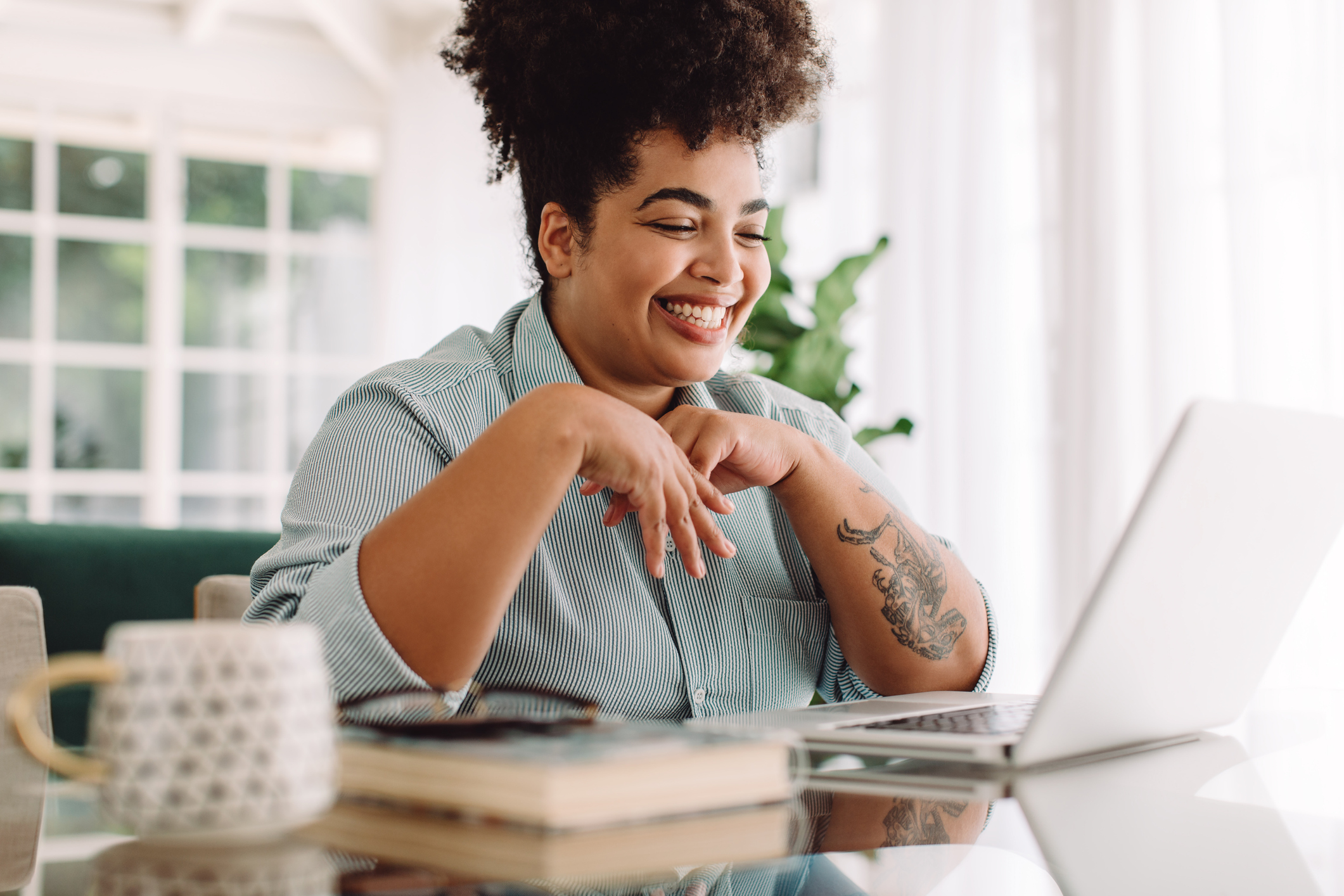 positive woman sitting at computer