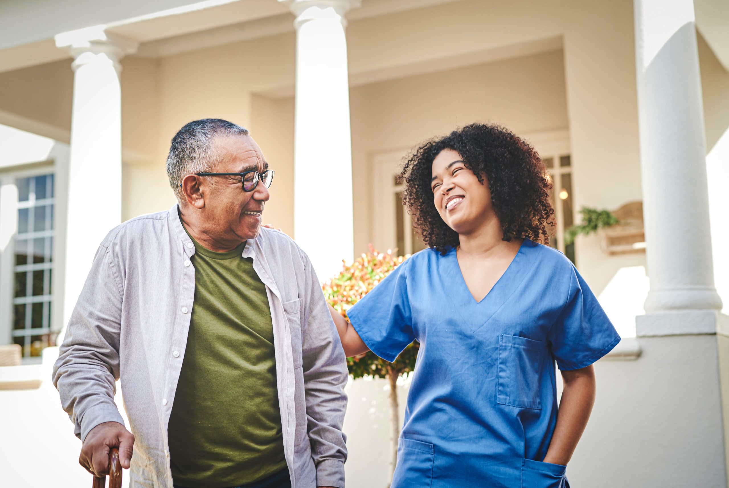 nurse and patient laughing together