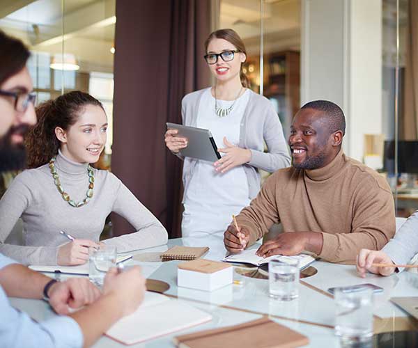 people conversing in a meeting room