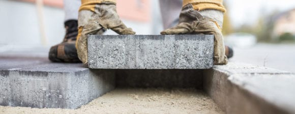 worker laying foundation